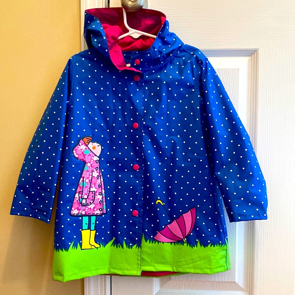 NWOT size 4 kid’s raincoat with hoodie.
